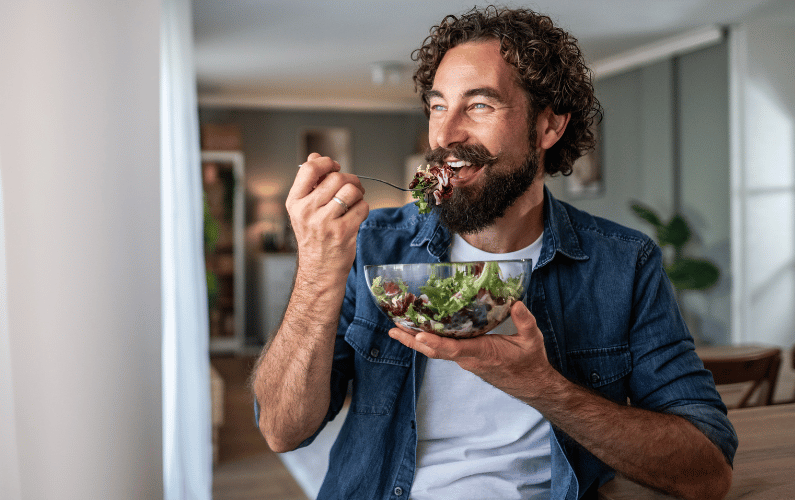Man eats salad
